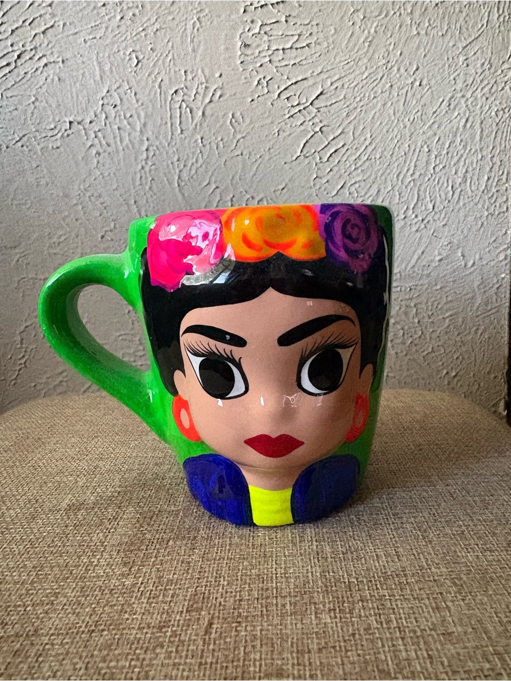 Decorative ceramic mug with face design